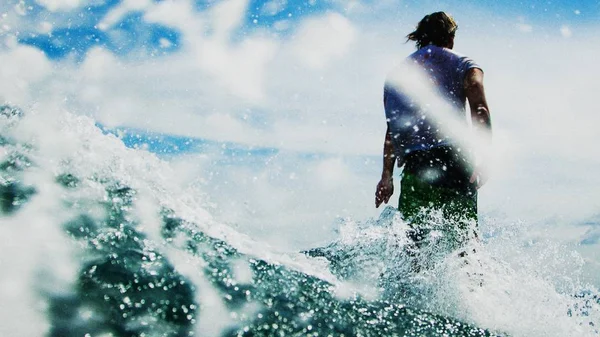 surfer catching breaking wave in Bali