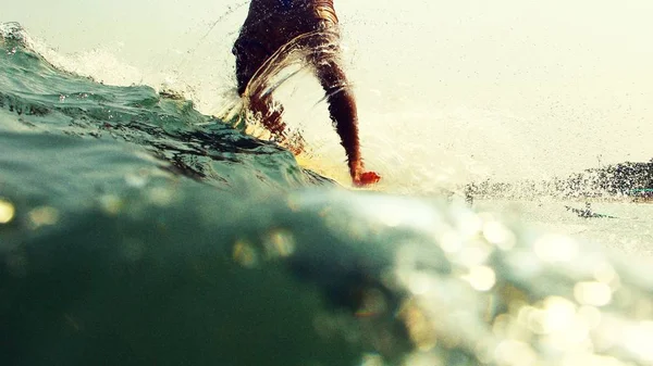 Male surfer legs on surfboard — Stock Photo, Image