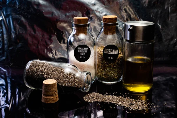 Közeli Kép Különböző Vetőmagok Fűszerek Olaj Tégelyekben Fekete Alapon — Stock Fotó