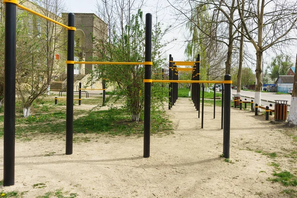 Playground with a horizontal bar on a city street