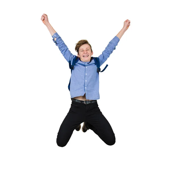 Overjoyed teenage guy jumping high in the air, hands raised up, — Stock Photo, Image