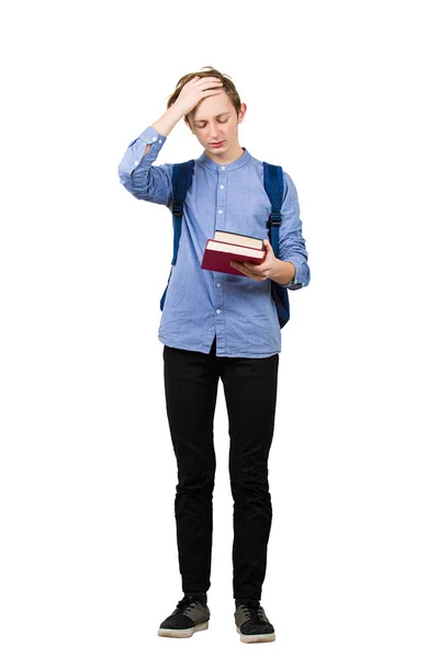 Verwirrter Student von der Hand zur Stirn, Geste mit dem Gesicht, hält Bücher — Stockfoto