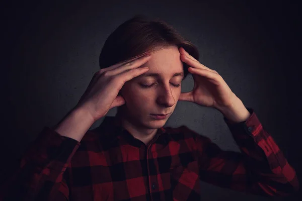 Headache feeling , emotional stress. Distressed teenager boy mes — 스톡 사진