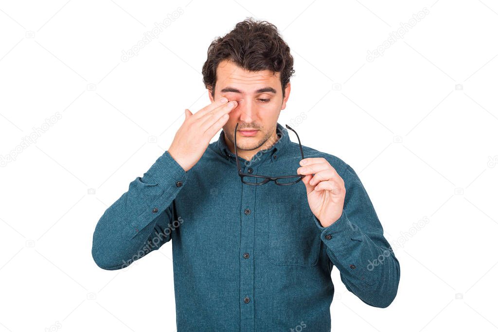 Fatigued businessman rubbing his eyes can't focus on daily work due poor eyesight, isolated on white background. Farsightedness, myopia health problem, suffering eye strain, sore and tiredness.