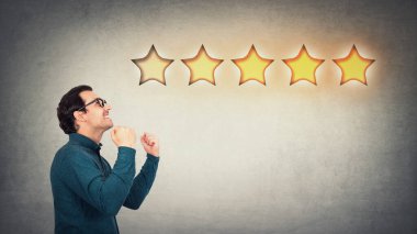 Overjoyed businessman keeps fists tight, celebrate success achievement, as receives positive feedback and approval. Boss, company owner cheerful as earns five stars rating excellent customer service. clipart