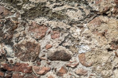 Çimento granit taş duvar kağıdı. Desen gri kırmızı tarzı sert yuvarlak dekoratif gerçek taş duvar yüzeyi ile çimento.