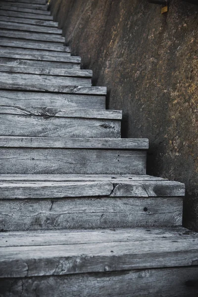 Viejas escaleras de madera al aire libre con la piedra —  Fotos de Stock