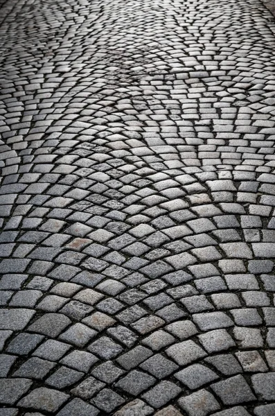 Stone path at the old town in Europe with sunlights. Texture, close up.