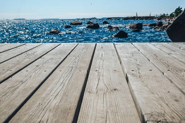 close up of wooden deck for design. Old pier over the sea