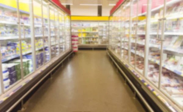 Blurred image of  supermarket aisle with shelves — Stock Photo, Image