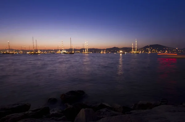 many sail boats on the sea at night. Saint Tropez