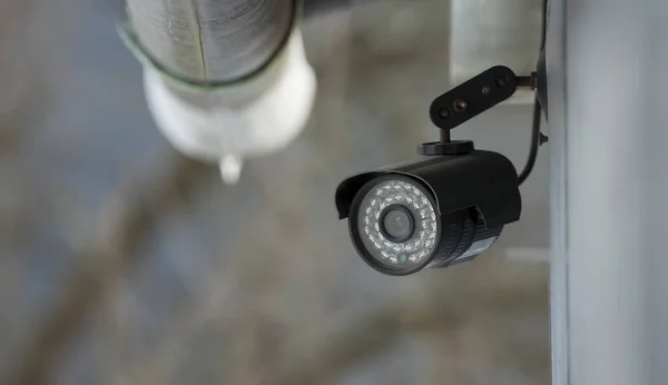 surveillance video camera mounted on house. home security concept