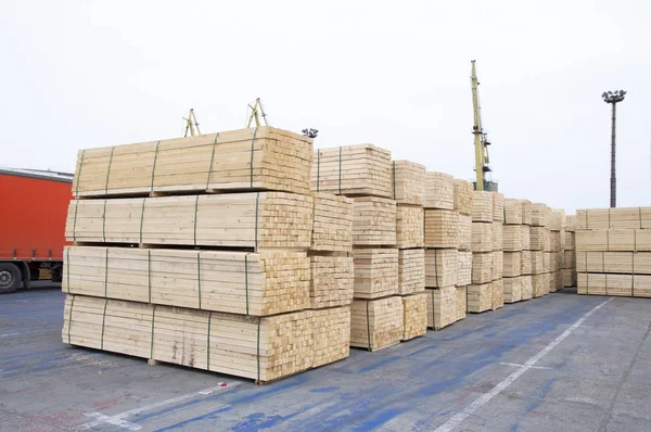 pile of wood timber ready for shipping at port