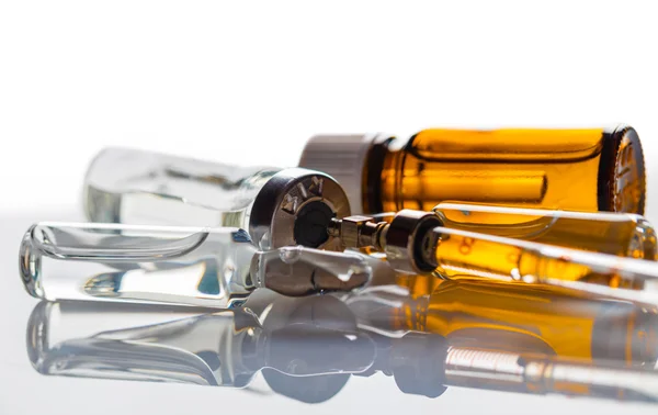 Medicament in a glass vial and syringe — Stock Photo, Image