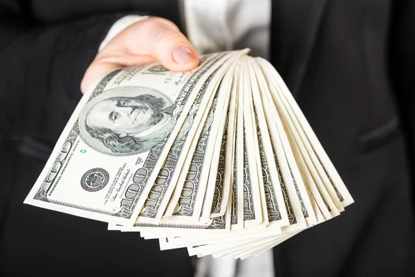 Woman holding money — Stock Photo, Image