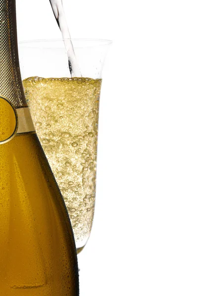 Пляшка шампанського зі склянкою — стокове фото