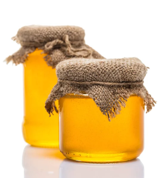 Glass jars of honey — Stock Photo, Image