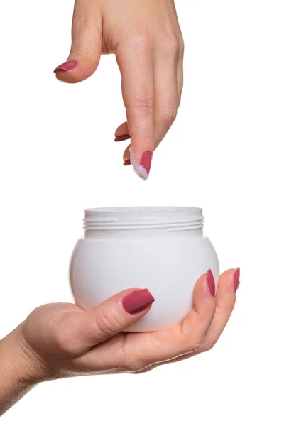 Mani con barattolo crema cosmetica — Foto Stock