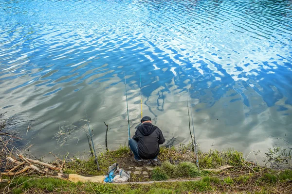 Man with fishing rods fishing — Stock Photo, Image
