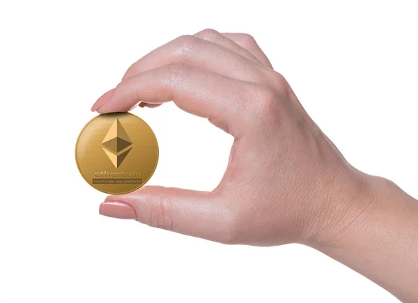 Ethereum coin in hand — Stock Photo, Image