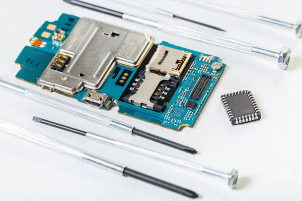 disassembled mobile phone and tools