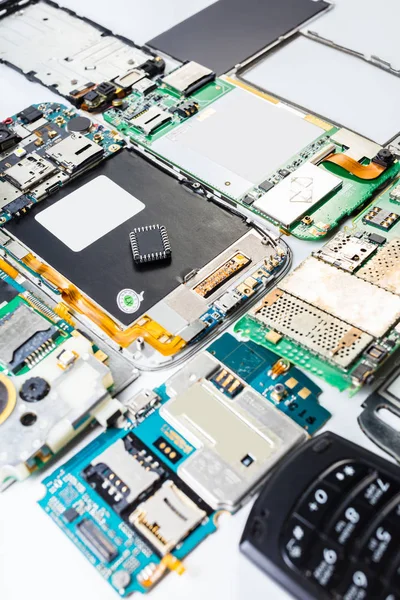 electronic chip on a disassembled mobile phone