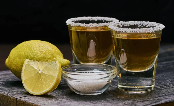 Alcoholic drink with lemon and salt — Stock Photo, Image