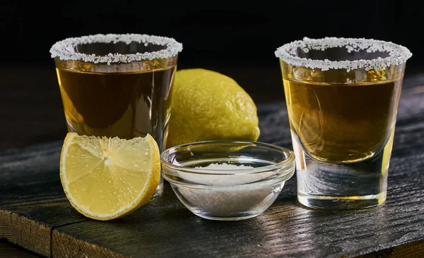 Alcoholic drink with lemon and salt — Stock Photo, Image