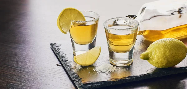 Alcoholic drink with lemon and salt — Stock Photo, Image