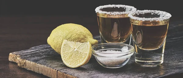Alcoholic drink with lemon and salt — Stock Photo, Image