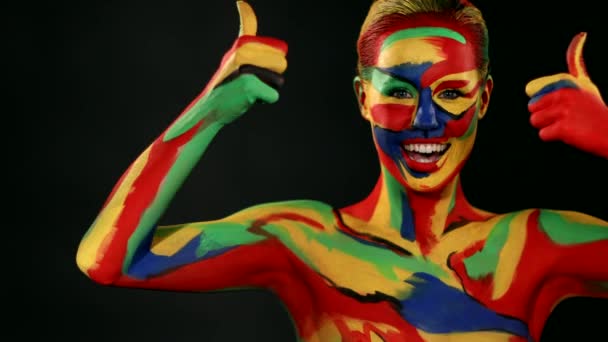 Woman with color face art and body paint. Colorful portrait of the girl with bright make-up and bodyart. — 비디오