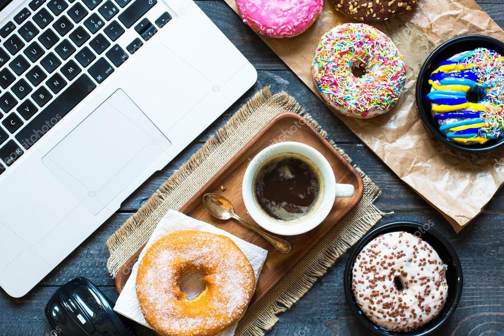 Donuts,  laptop, a coofee mug  