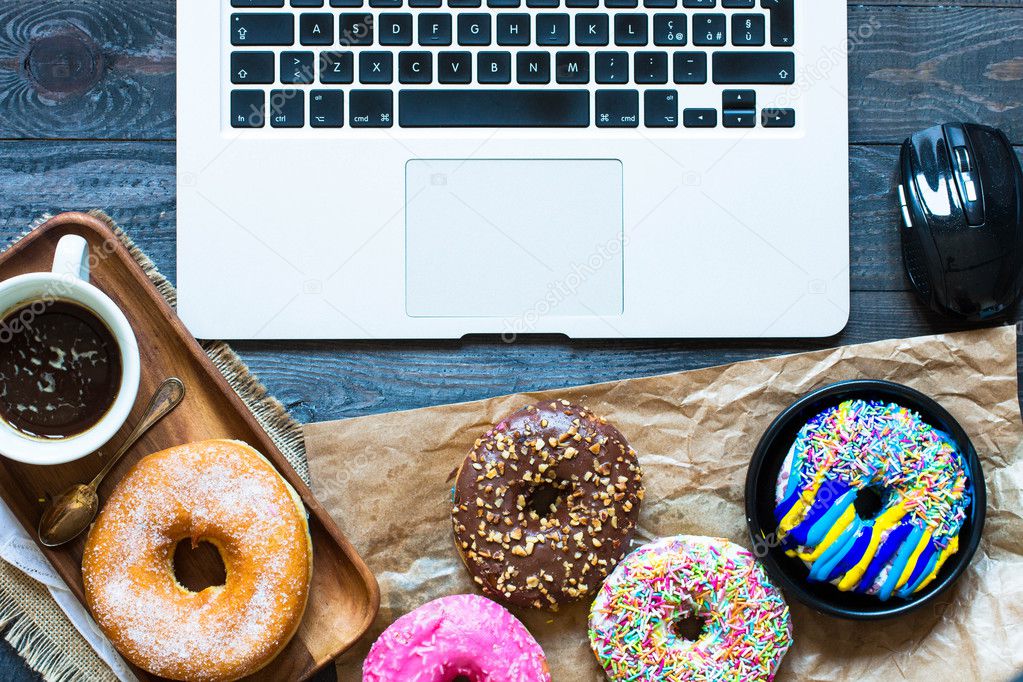 Donuts,  laptop, a coofee mug  