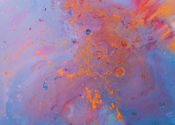 Abstract orange and violet color mix in milk and oil — Stock Photo, Image