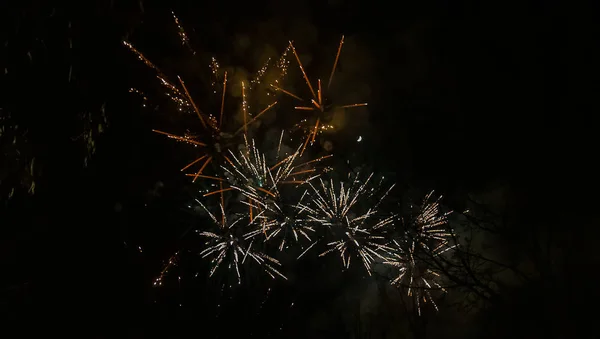 Amazing orange fireworks on night dark sky. New years eve celebr — 스톡 사진