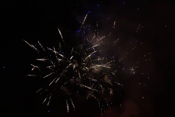 Amazing gold and blue fireworks on night sky. New years eve cele — 스톡 사진