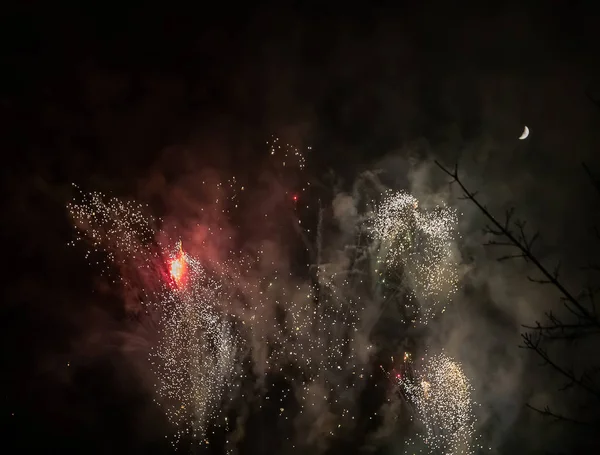 Nice colorful red fireworks on night dark sky. New years eve cel — 스톡 사진