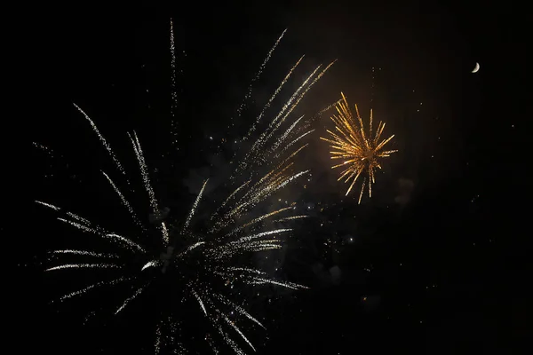 Amazing orange fireworks on night sky. New years eve celebration — Stock Photo, Image