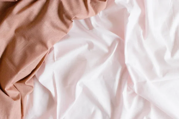 Pale pink crumpled linens