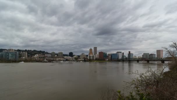 Time lapse movie of moving clouds over Portland Oregon downtown city skyline with Hawthorne bridge along Willamette River one stormy winter day 4k uhd — Stock Video