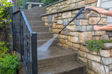Pressure Power Washing the Front Entrance Stair Steps clipart