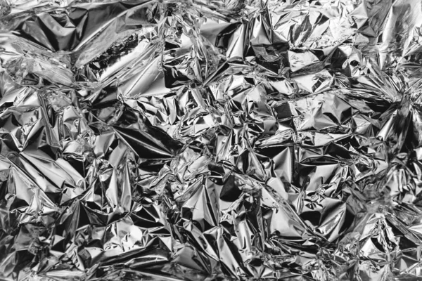 crumpled silver foil sheettexture of shiny crumpled piece foil