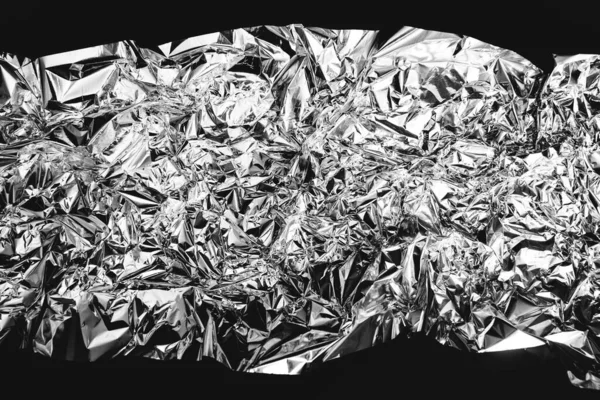 crumpled silver foil sheettexture of shiny crumpled piece foil