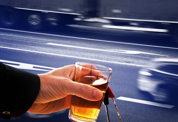 Hard drinker with liqueur glass and going cars — Stock Photo, Image