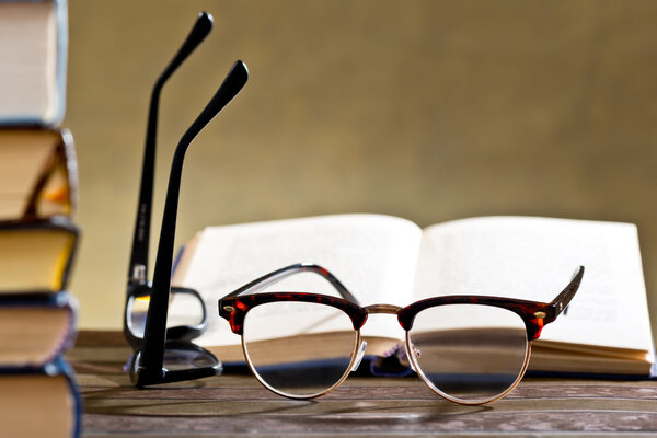eyeglasses with books