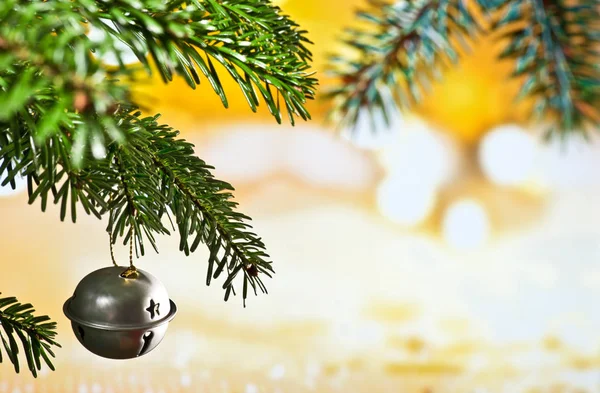 Christmas Bell with Christmas Twig on the Unfocused Background — Stock Photo, Image