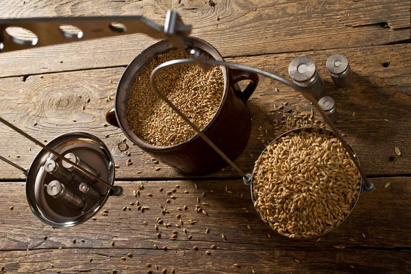 Man Weighs Malt for Home Brewing of Beer. Top View. — Stock Photo, Image