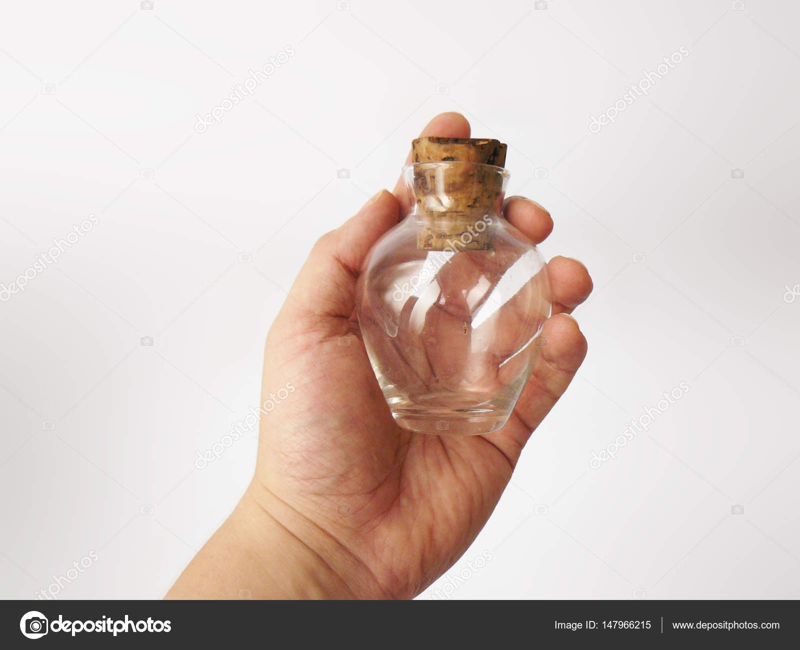 Vintage Glass Jar Small Vials Bottle With Cork Vintage Glass Jar Small Vials Bottle With Cork For Oil White Flowers Decanter Stopper On Background