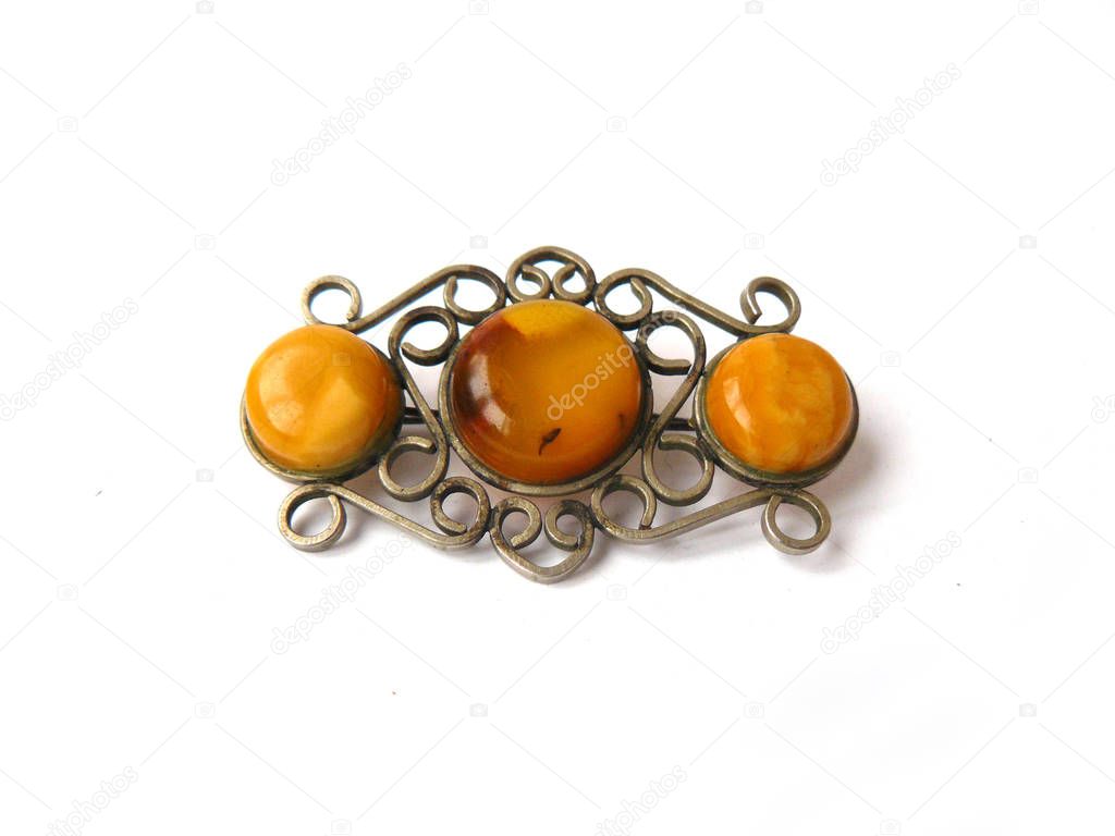 Brooch, amber brooch, openwork brooch, amber, white background, openwork silver, curls, fine wire, openwork wire, round amber, three amber. Headstock stock image.