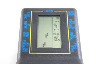 Elektronik oyun, tetris, elektronik tetris, elektronik oyuncak, siyah kabuk, blue düğmeler, bebek oyuncak, yakın çekim, beyaz arka plan, sap kafası stok görüntü, Nostalgishop